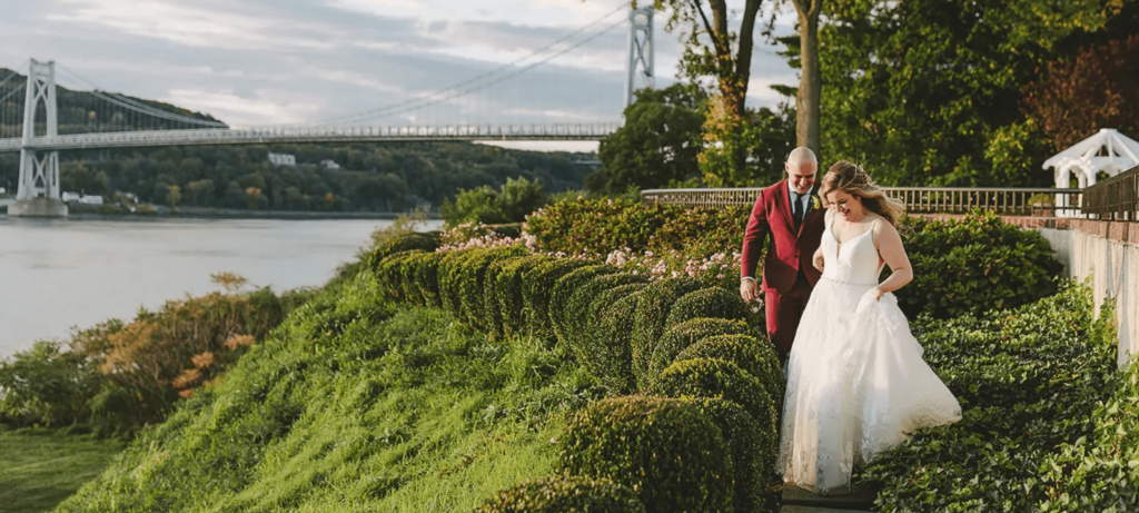 Couple walks through the outdoor gardens at The Grandview. 